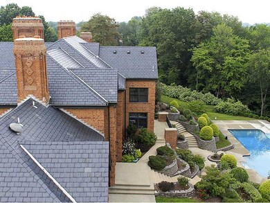 Exterior Back. Outside, exquisite landscaping prov