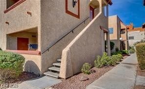 View of side of home with stucco siding
