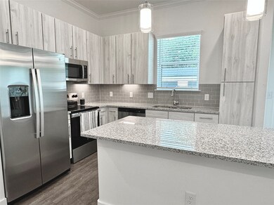 Kitchen with SS appliances, granite countertops, a