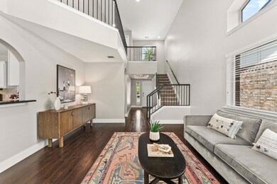 Living room with a towering ceiling, plenty of na