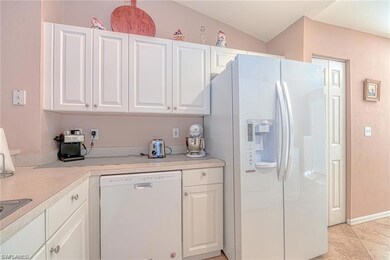 Kitchen featuring light tile patterned floors, whi