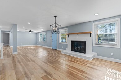 Unfurnished living room with ceiling fan with nota