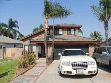 Front view of home with RV parking on the left