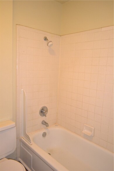 Bathroom featuring  shower combination and toilet