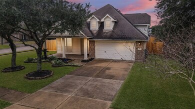 This charming home is situated on a corner lot and offer a lush front yard.