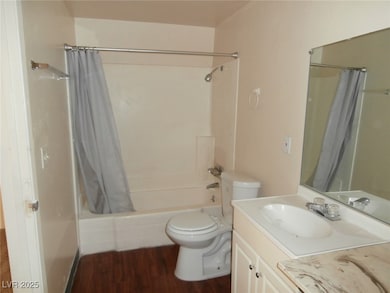 Bathroom with toilet, shower / bath combination wi