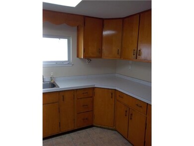 Kitchen. Kitchen includes, refrigerator, stove and