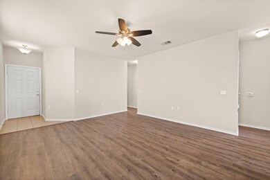 Empty room featuring dark wood-type flooring and 