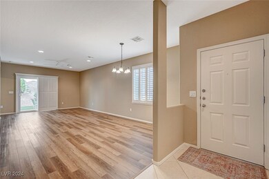 Enter through the front door to an open living/din