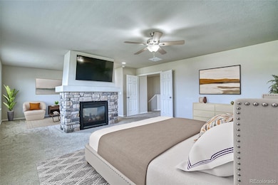 Primary Bedroom with Sitting Area & Double-Sided Fireplace