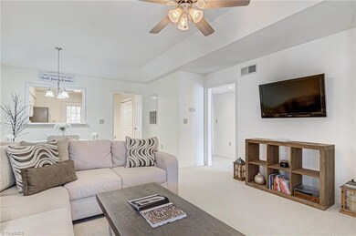 Smooth transition between living areas! Middle doorway leads to two large bedrooms.