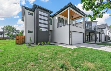 Contemporary house featuring a balcony, a garage, 