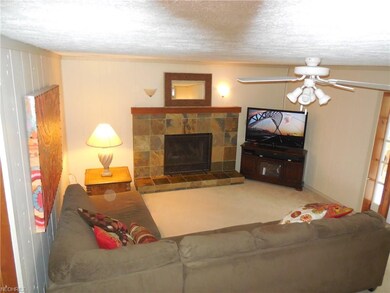 Family Rom with wood burning fireplace, wall to wa