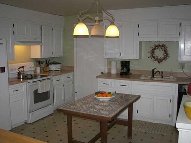 Kitchen. Home also features newer vinyl windows. a