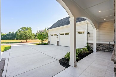 View of patio / terrace with a garage