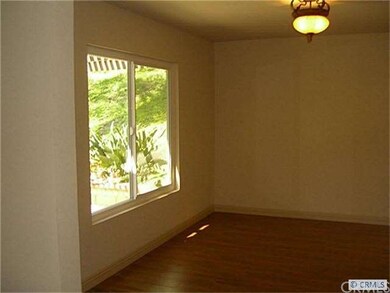 Dining room with new flooring and freshly painted.