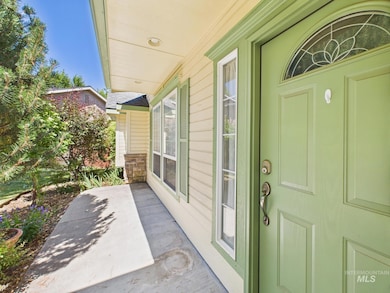 Property entrance featuring covered porch