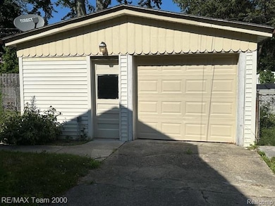Garage featuring driveway