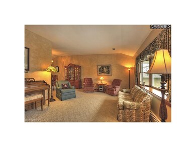 LIVING ROOM IS WELL LIGHTED BY THE BAY WINDOW