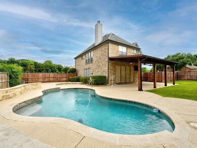 Sparkling pool and covered outdoor living area!