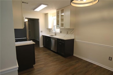 Kitchen featuring stainless steel dishwasher, a si