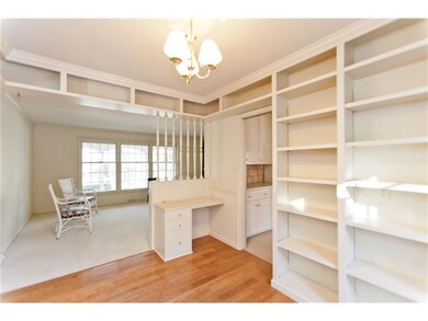 Dining room area with hardwood flooring and built 