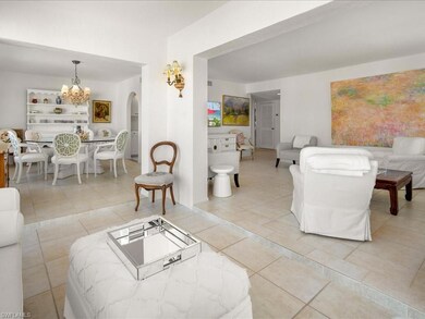 Living room with light tile patterned flooring and