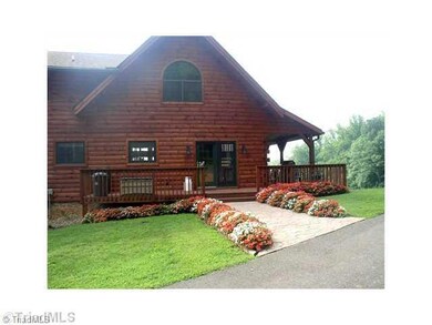 Exterior Back. Three covered porches plus back deck area for relaxing and entertaining