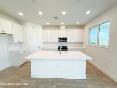 8570 Langila Dr, Melbourne, FL 32940 - photo 5