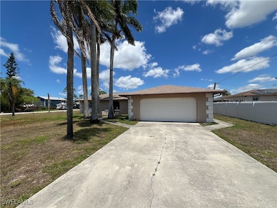View of front of home with stucco siding, an attac