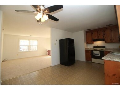 Large eat-in kitchen with ceiling fan open to the 