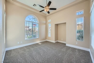 Front living room with lighted ceiling fan