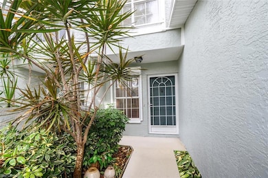 View of exterior entry featuring stucco siding