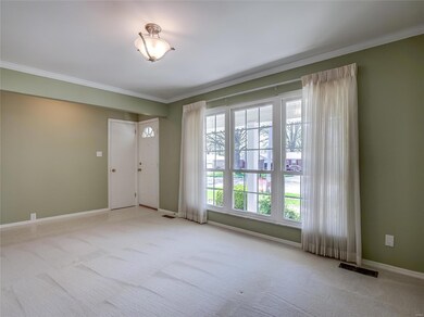 The front living room gets plenty of natural light from the large windows.