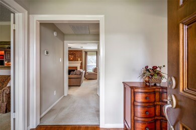 As you enter, the home, the warmth of the polished wood floors welcomes you.