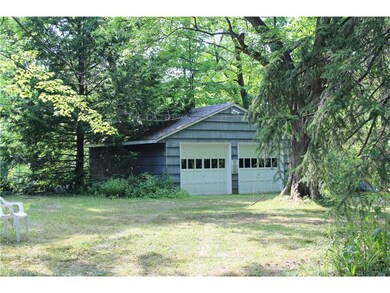 Tucked in amongst the trees is your 2 car garage-