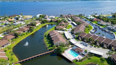 Birds eye view of property with a water view and a