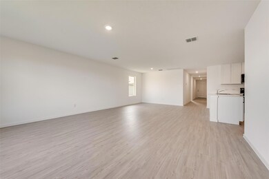 Spare room featuring light hardwood / wood-style f