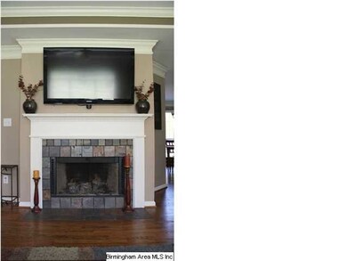 Lovely tile surround gas fireplace.