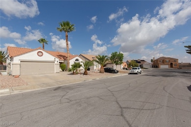 View of asphalt road featuring a residential view,