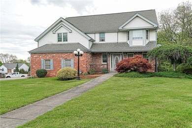Fabulous curb appeal with mature landscaping.