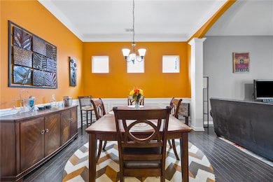 Dining area with an inviting chandelier, ornate co