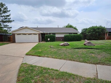 Single story home featuring brick siding, fence, d