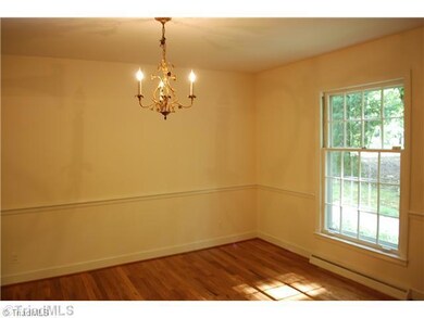 Dining Room. Classic floor plan: Formal living room flows into formal dining room which features an antique light fixture.
