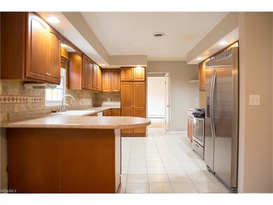 Looking into the kitchen from the dining room. Fam