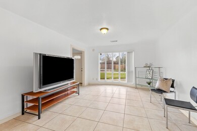 Living area with a nice bay window.