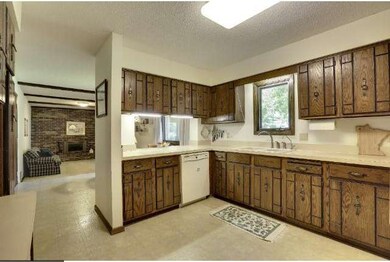 Spacious kitchen with lots of cabinets and counter