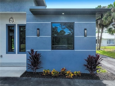 View of side of home with stucco siding