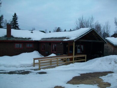 Rear entrance to kitchen provides...