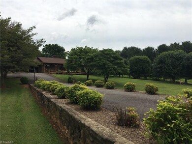 Well maintained yard with lots of shade trees. Home sits back off the road.